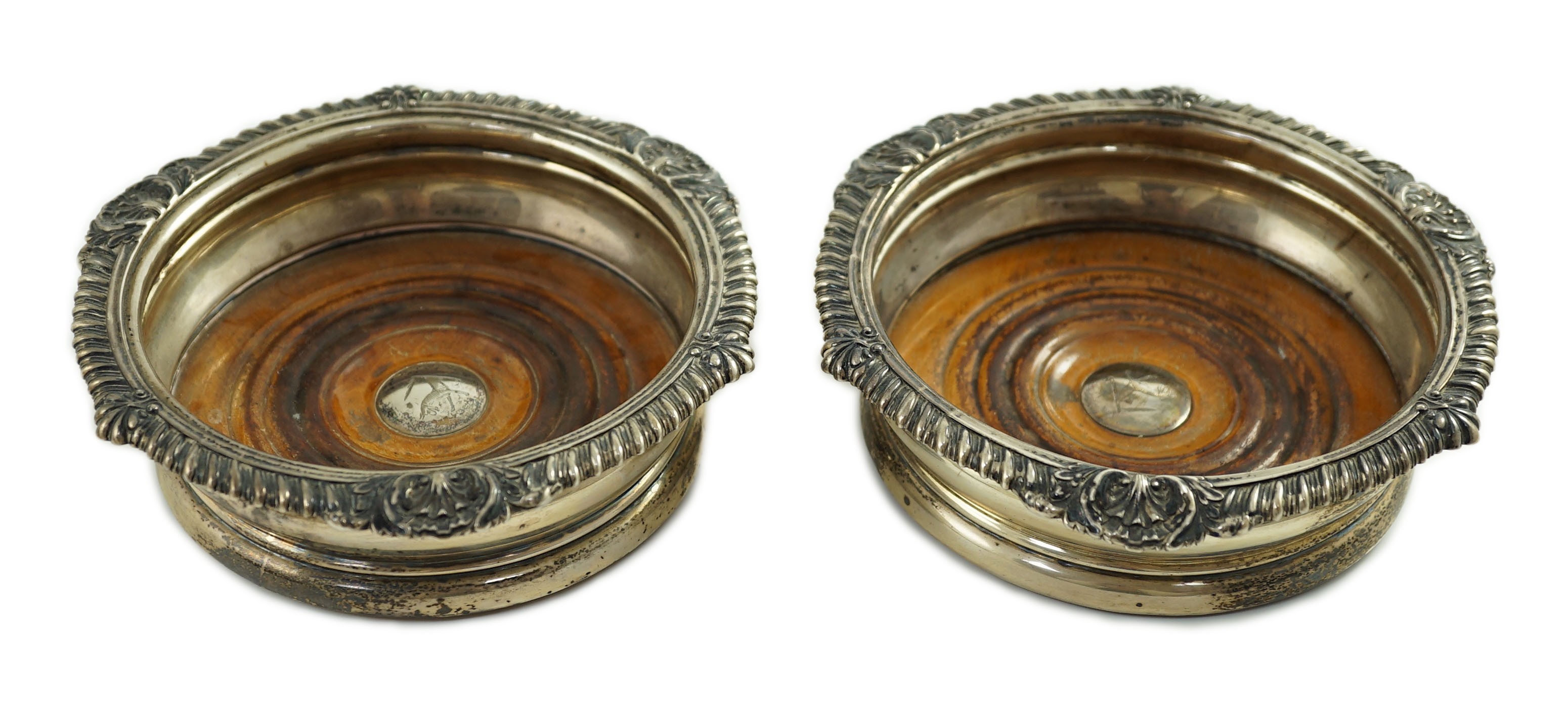 A pair of George IV silver mounted wine coasters by John Walton?